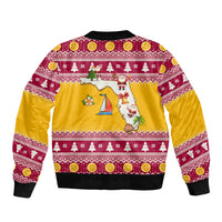 Unisex bomber jacket, maroon and gold holiday print on back, ribbed hem and cuffs