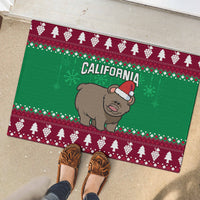 Green Christmas rubber doormat with CALIFORNIA and grizzly bear Santa hat, top view