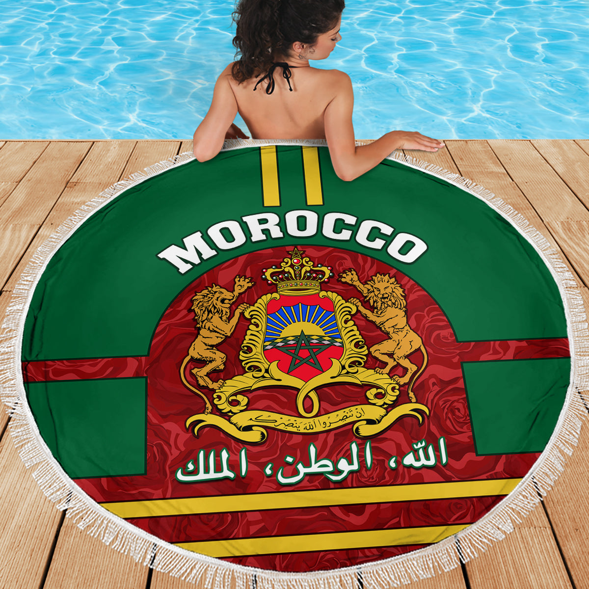 Round Morocco beach blanket, green with tassel fringe and coat-of-arms emblem