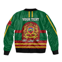 Green bomber jacket with front zipper, Morocco crest graphic, yellow striped trim, sleeve flag patch
