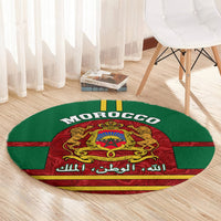 Green round carpet with MOROCCO text and central red coat of arms