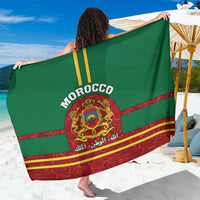 Green and red Morocco sarong with crest and “MOROCCO” lettering, decorative stripes
