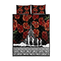 Black quilt bed set with red poppy florals, Polynesian border, soldier silhouettes; 2 pillows.