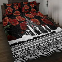 Black quilt bedspread with red poppy florals, Polynesian pattern edge, white aircraft silhouettes.