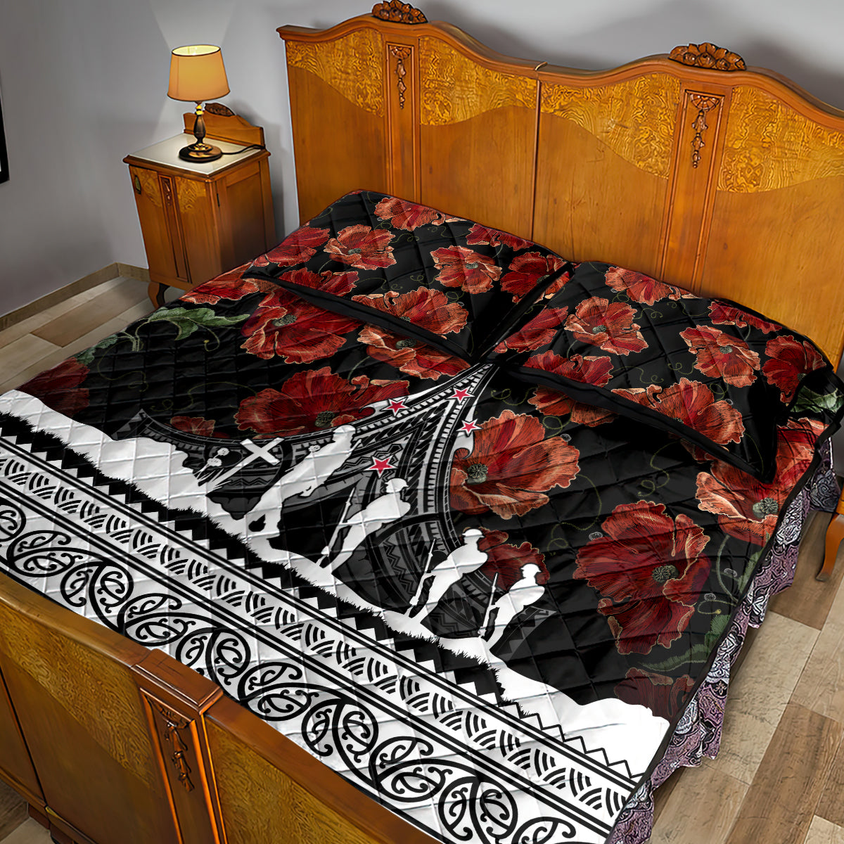 Black quilt bed set on bed with red poppy florals, white aircraft and Polynesian border; pillows.