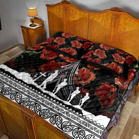 Black quilt bed set on bed with red poppy florals, white aircraft and Polynesian border; pillows.