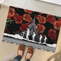 Black rubber doormat with red poppies and white memorial silhouettes, decorative bottom band