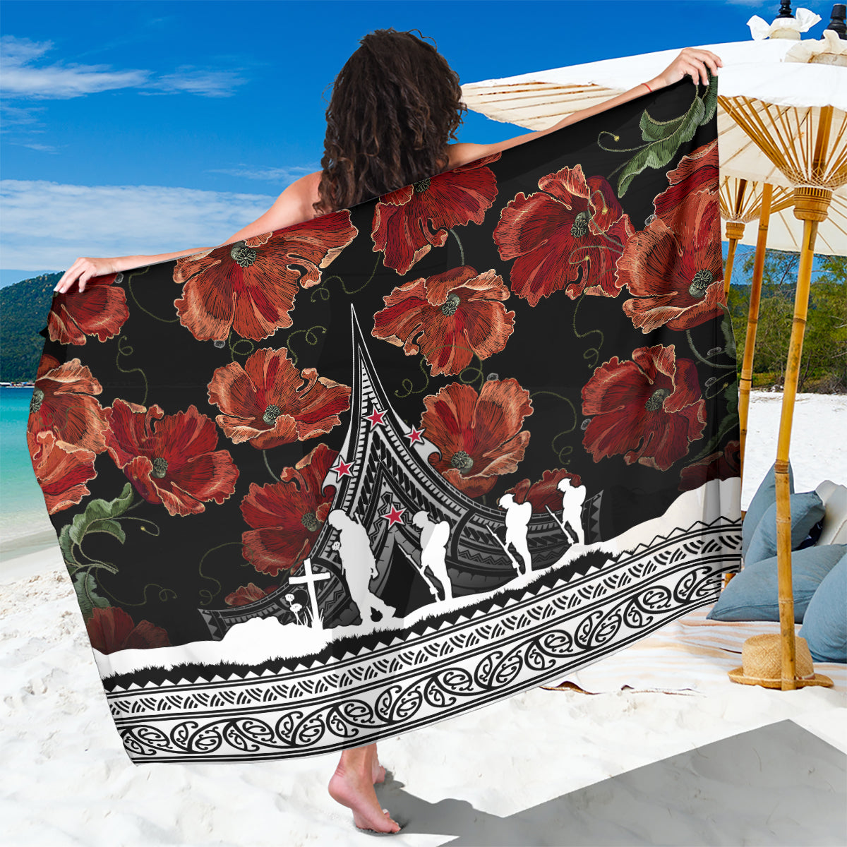 Black beach sarong with red poppy florals and Polynesian-style border design