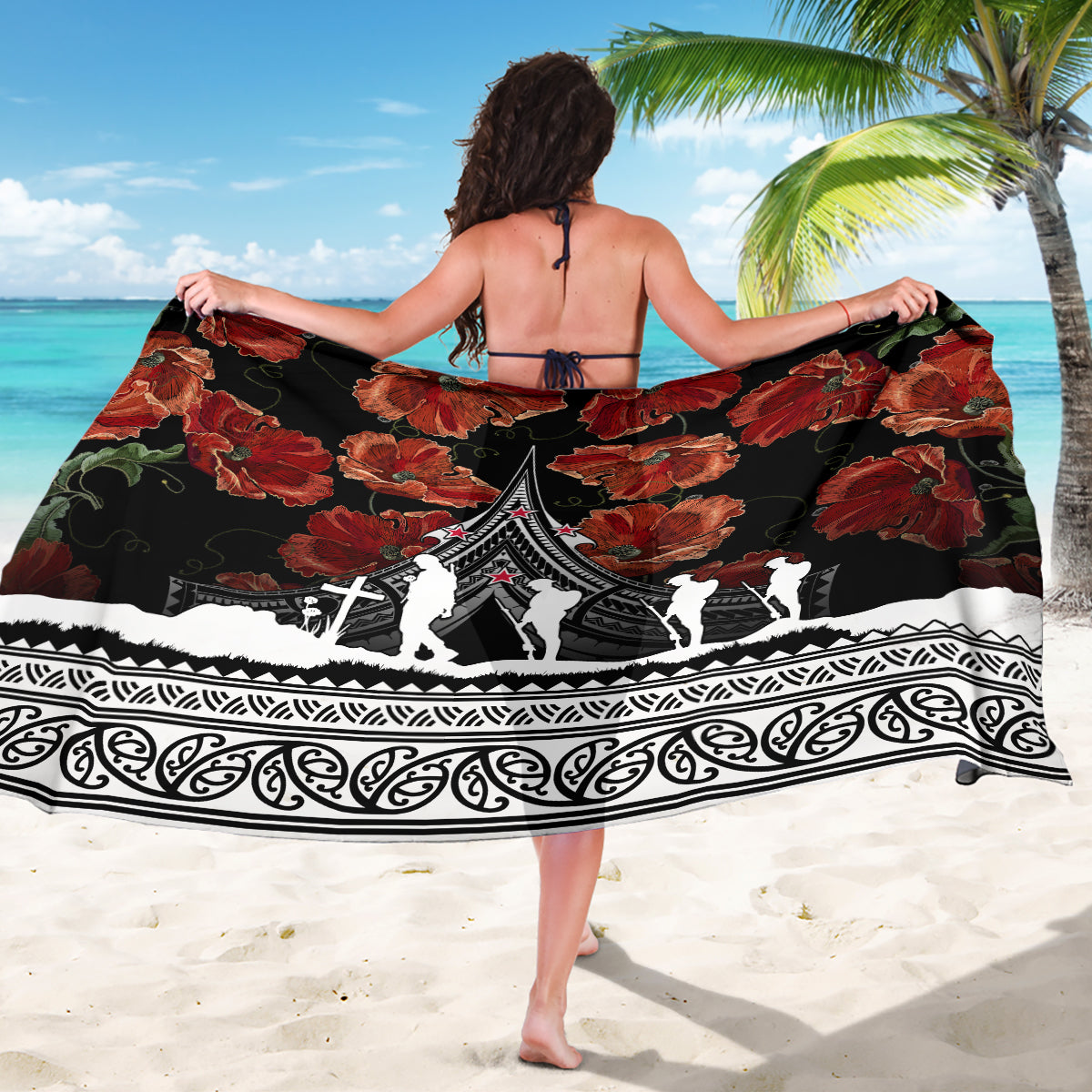 Black sarong with red floral pattern, central white silhouettes, and ornate trim