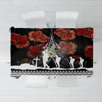 Black tablecloth with red poppies, white Polynesian-style border and central silhouette design