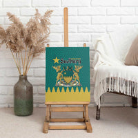 Green canvas wall art on wooden easel with Greater Sudbury crest and evergreen trees