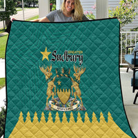 Green quilt with Greater Sudbury crest, star and yellow zigzag pattern
