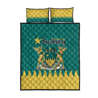 Quilt bed set in teal and yellow with decorative emblem artwork and two pillow cases