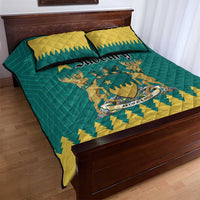 Teal and yellow quilt bed set with central emblem and zigzag border, with two pillows