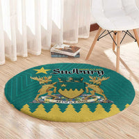 Green round carpet with Sudbury crest center and gold border detail