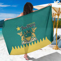 Green and yellow Sudbury crest sarong with diagonal logo and trees graphic