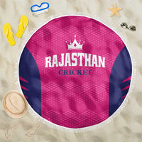 Round pink beach blanket with navy side panels, white fringe edge, RAJASTHAN CRICKET print