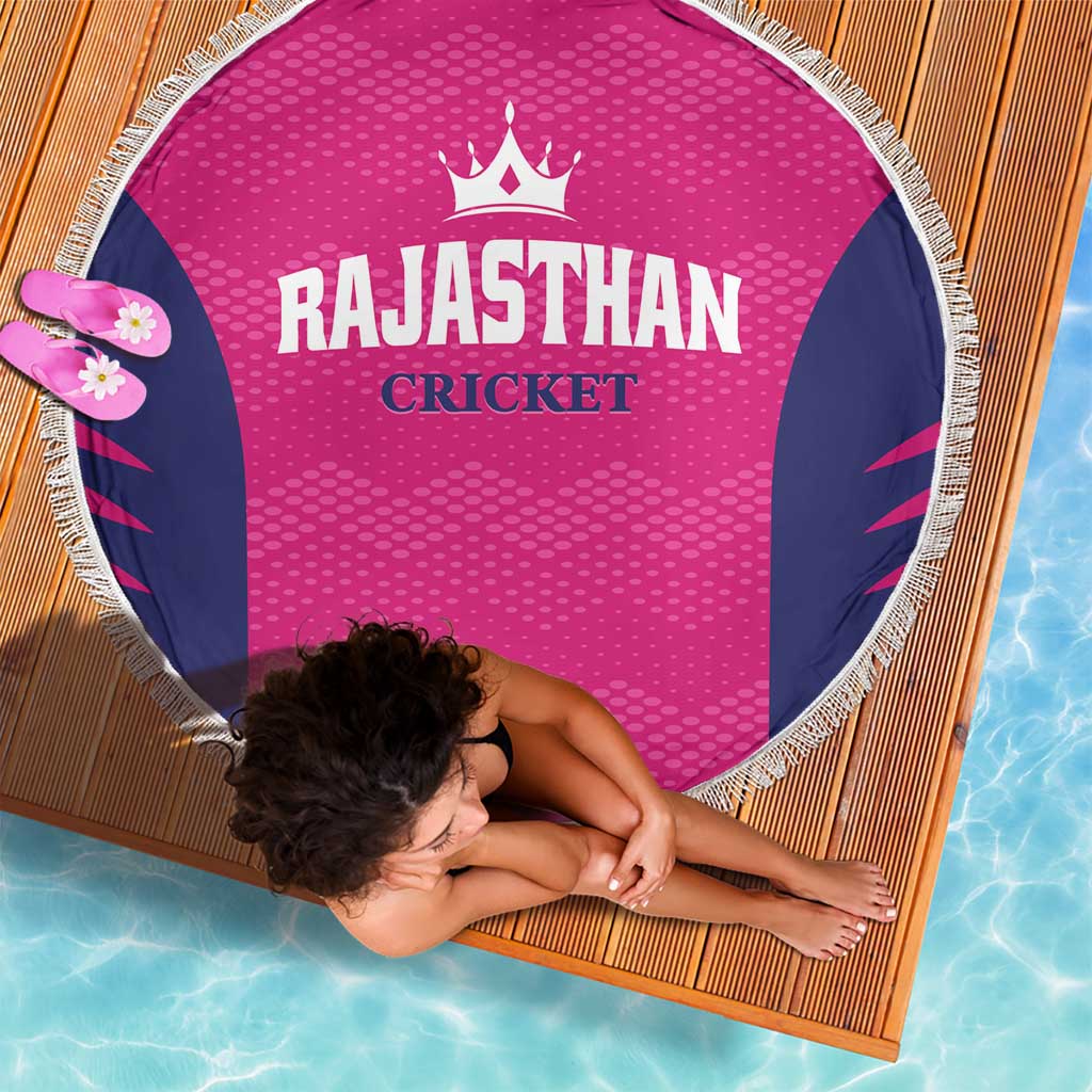 Round pink beach blanket with navy side panels and white fringe, RAJASTHAN CRICKET logo