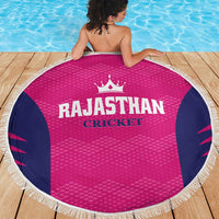 Round pink beach blanket with navy side panels, white fringe border, RAJASTHAN CRICKET print