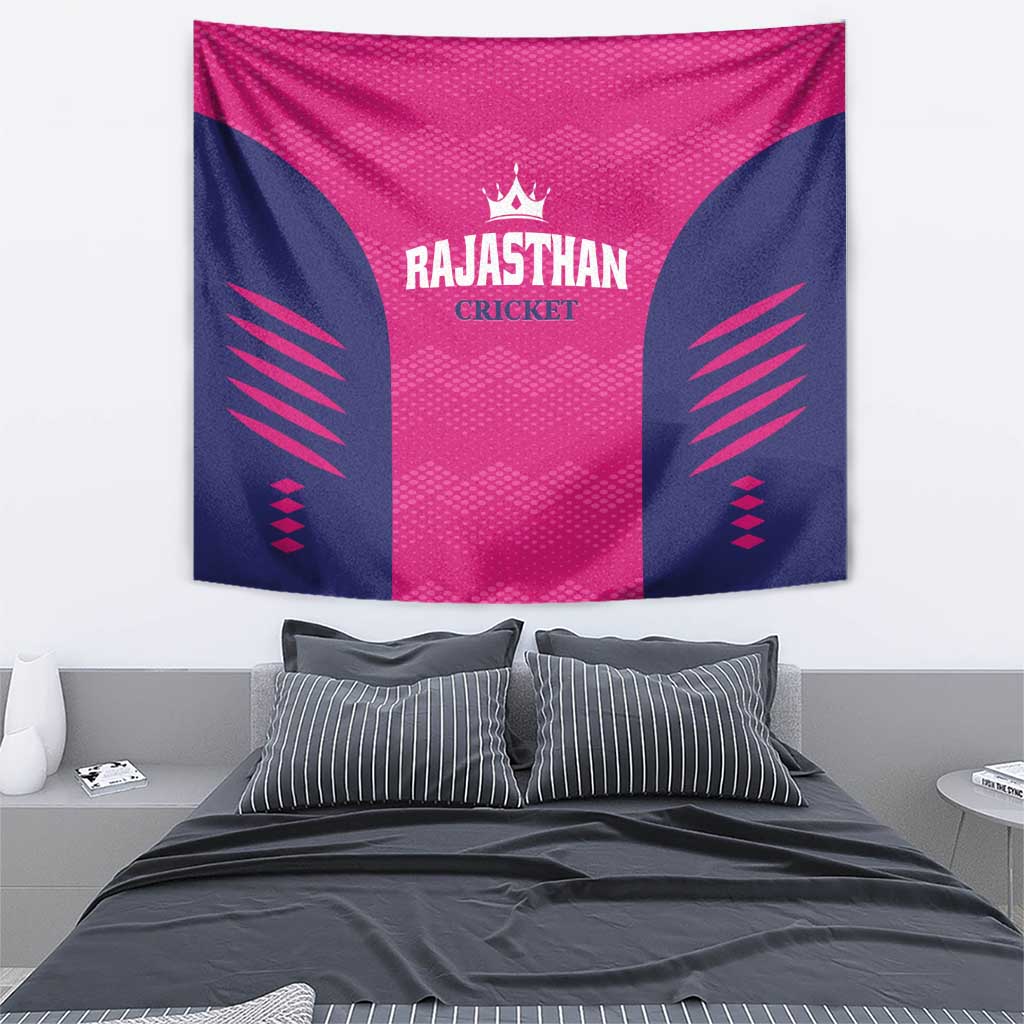 Pink and navy cricket tapestry featuring Rajasthan Cricket text, crown emblem, and side stripes.