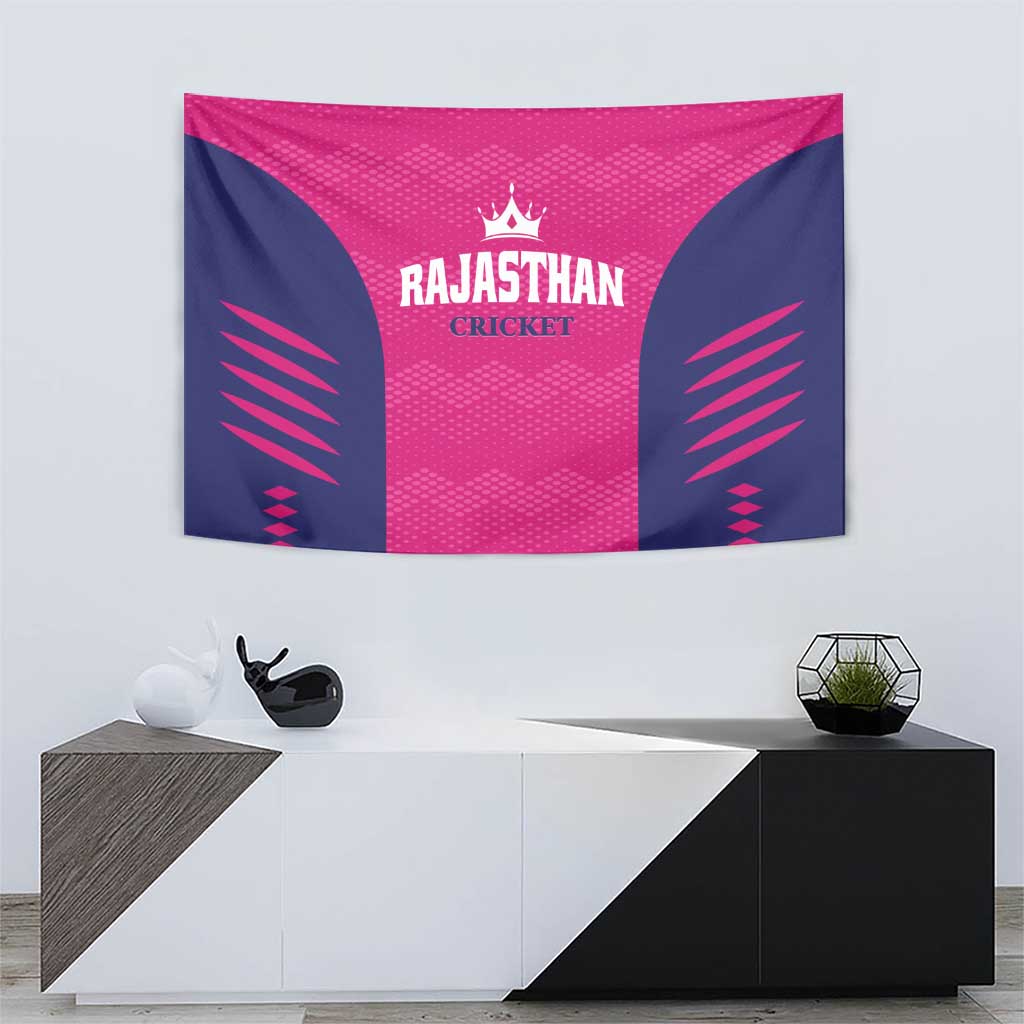 Pink and navy cricket tapestry wall hanging with Rajasthan Cricket logo centered on fabric.