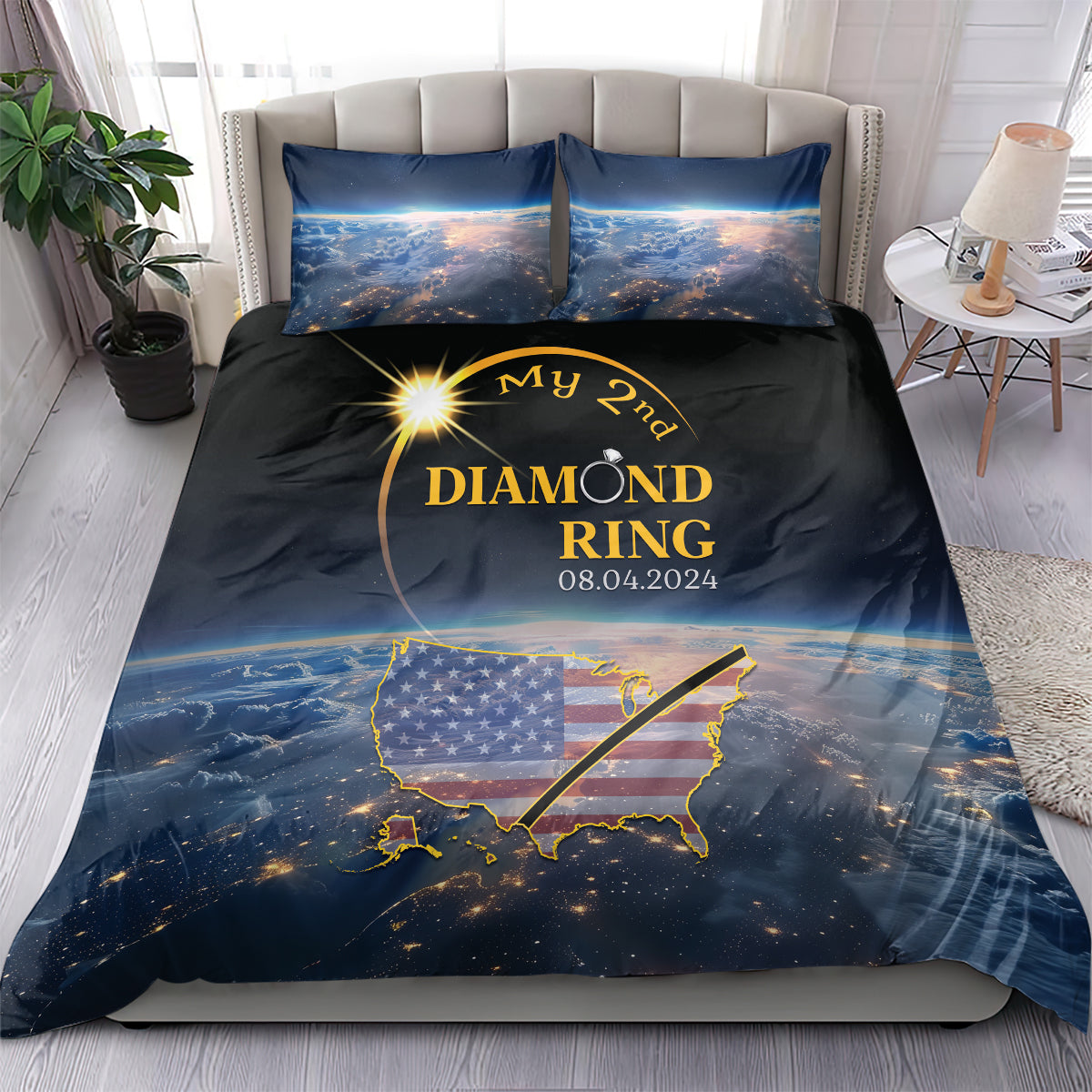Total eclipse bedding set on bed: black/blue duvet cover with gold ring design and pillows