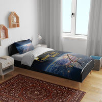 Bedroom bed setup with black and blue total eclipse bedding set and gold ring-themed artwork