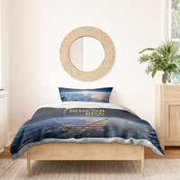 Total eclipse bedding set on a wooden bed: black/blue duvet with gold ring graphic
