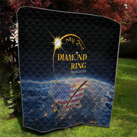 Black quilt with quilted texture, gold diamond ring design, date, and US map