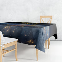 Black tablecloth draped on table edge, gold/orange planet-like print
