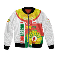 Unisex white bomber jacket with green/red Madagascar emblem front and ribbed cuffs