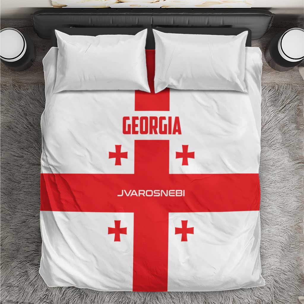 Georgia football bedding set with white cover, red cross, and red accents on pillows.