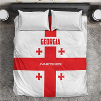 Georgia football bedding set with white cover, red cross, and red accents on pillows.