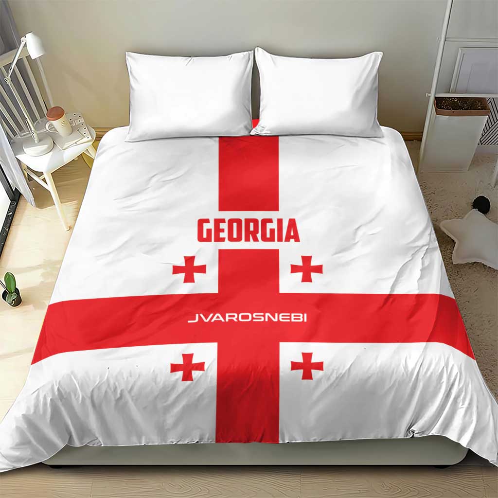 Georgia bedding set on bed: white duvet with red cross, Georgia lettering, and small red crosses.