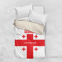 Georgia bedding set with white cover, red cross motif, and red Georgia text on duvet.