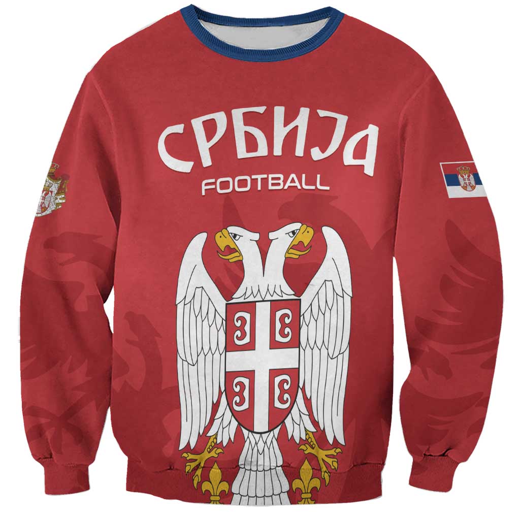 Red unisex football sweatshirt with Serbia crest and angel wings graphic on front