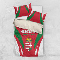 Hungary bedding set showing folded comforter and pillow with crest and rays