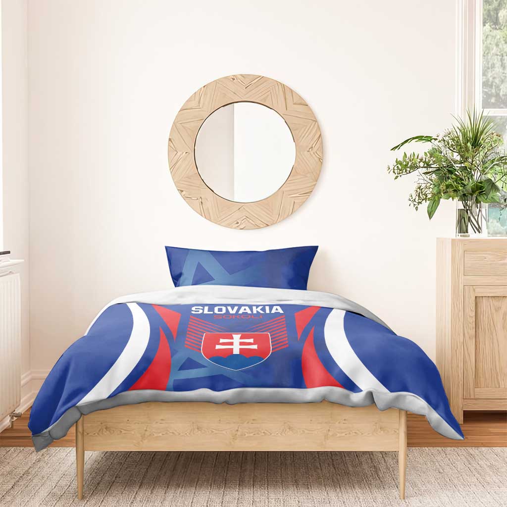Blue duvet with Slovakia crest and matching pillowcases on a wooden bed