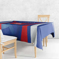 Blue and red football tablecloth draped over rectangular table with team logo panel