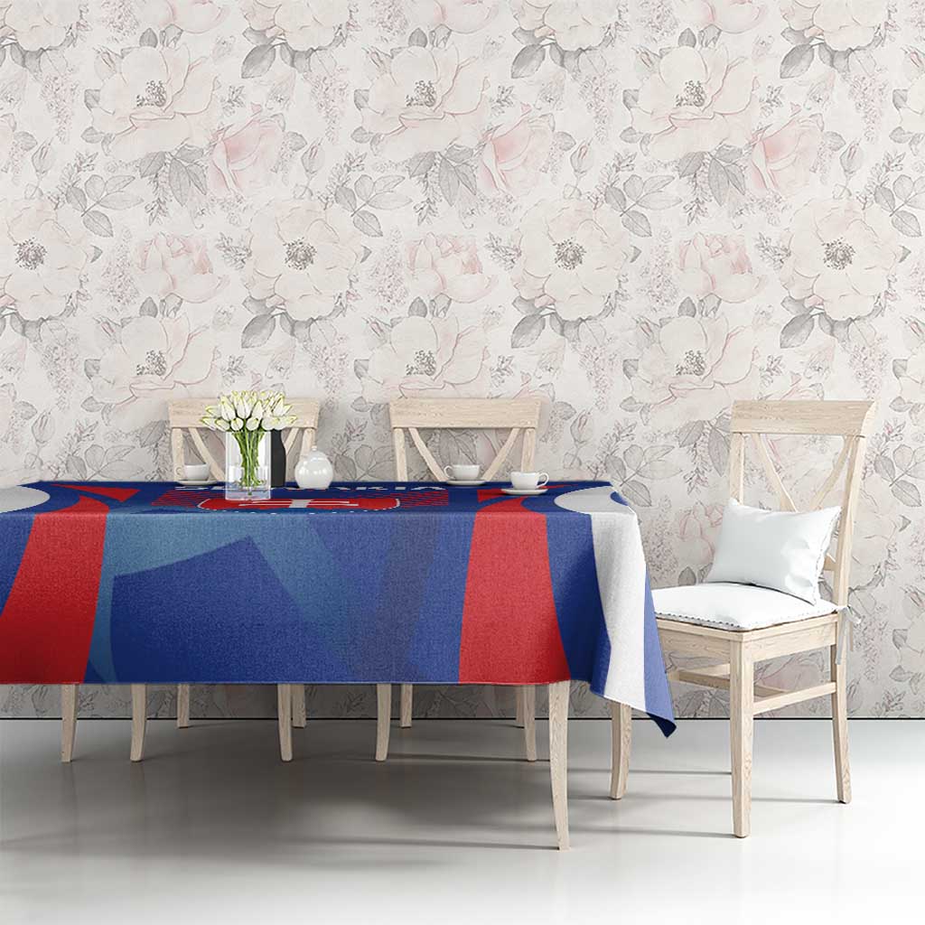 Blue football tablecloth with red stripe pattern and Slovakia crest on dining table