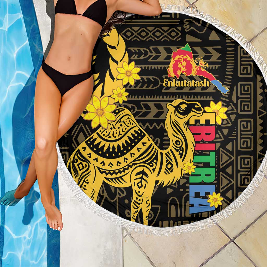 Round black-and-gold camel beach blanket with multicolor vertical text and fringed edge