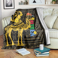 Black throw blanket with gold camel and geometric motifs, Enkutatash logo and multicolor vertical design