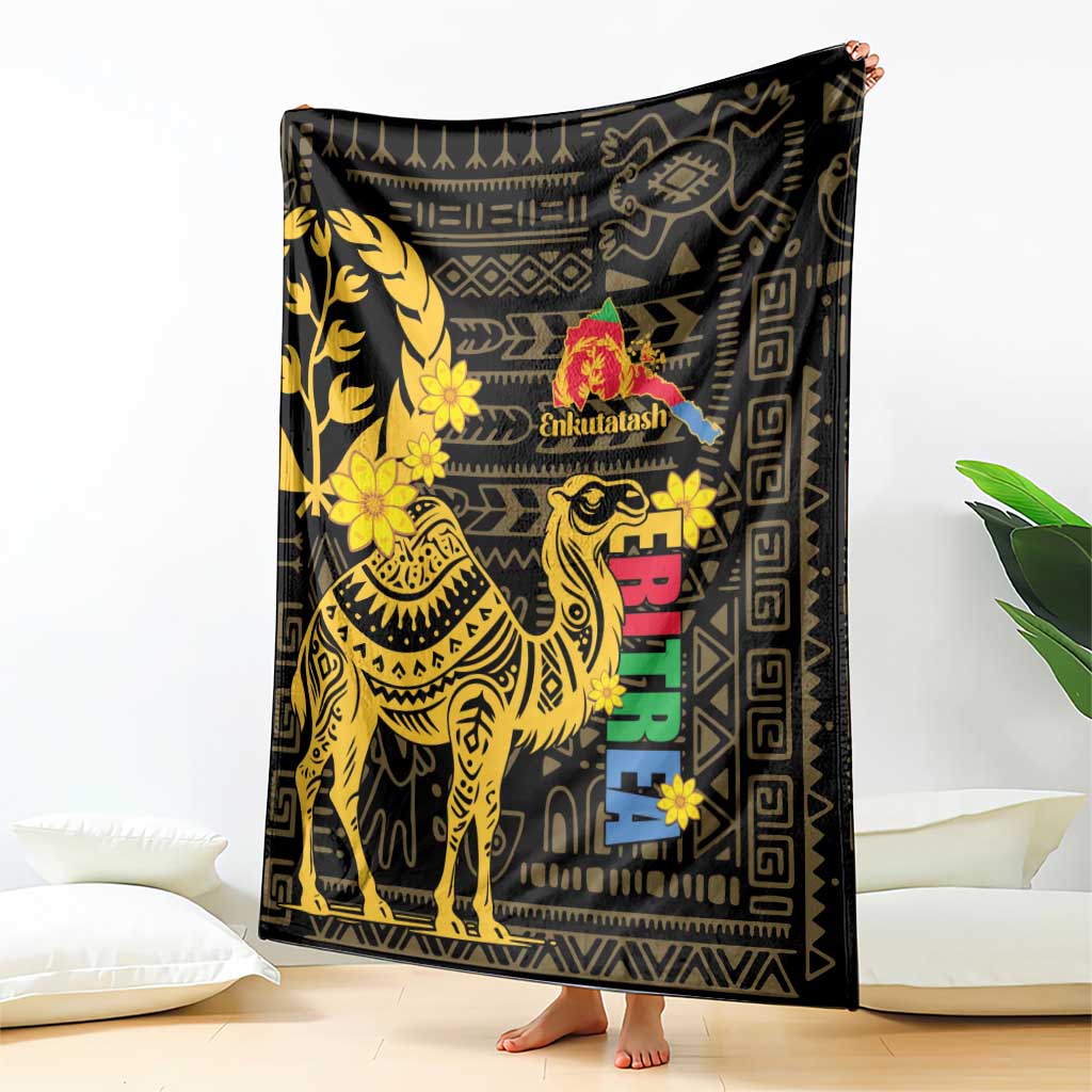 Black blanket with gold camel and floral pattern, Enkutatash logo and multicolor blocks