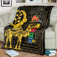Black blanket with gold camel, Greek-key borders, Enkutatash logo and colorful vertical blocks