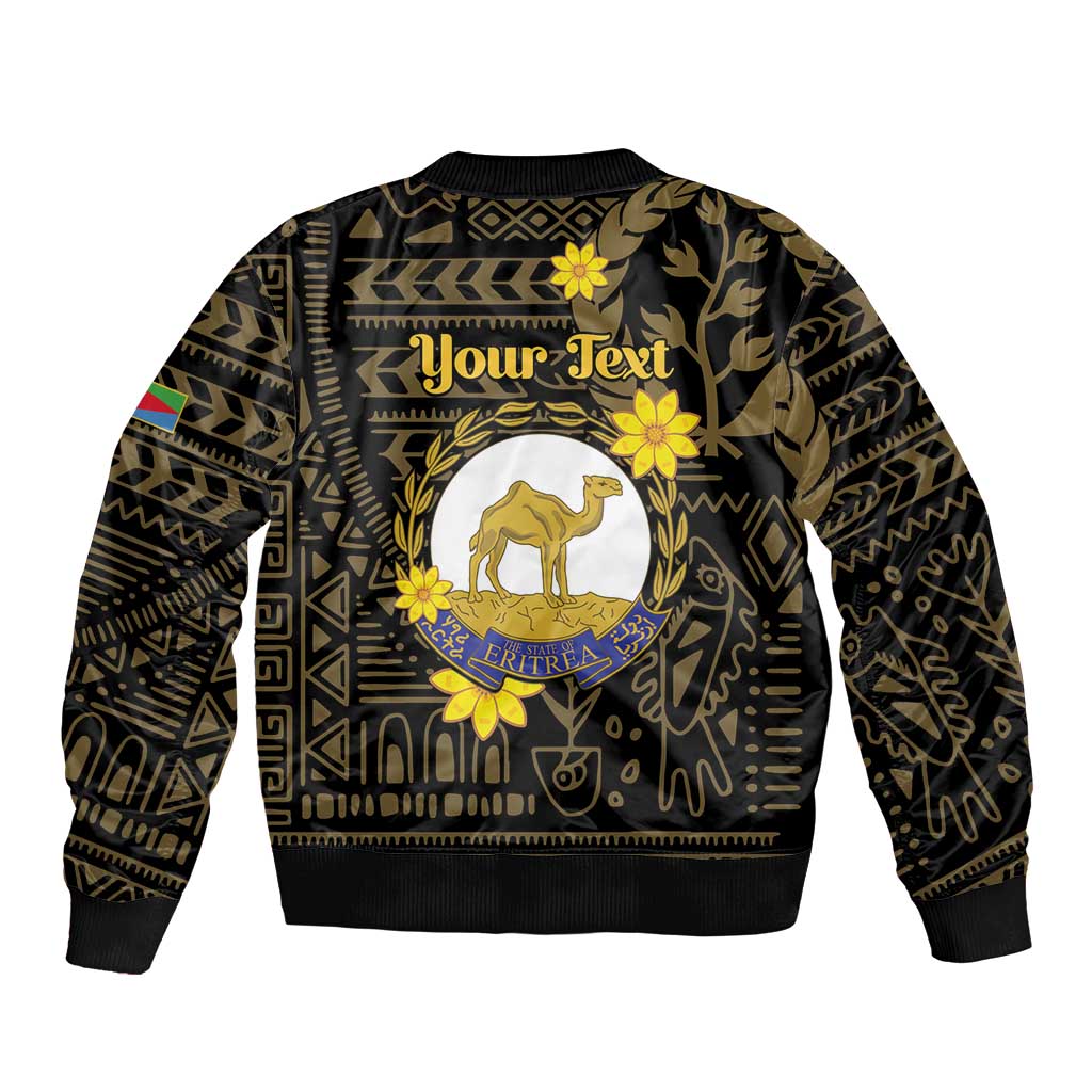 Unisex black bomber jacket back with camel emblem, gold floral geometric detailing, ribbed hem