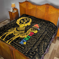 Yellow and black quilt on a bed, featuring a camel figure and geometric motifs