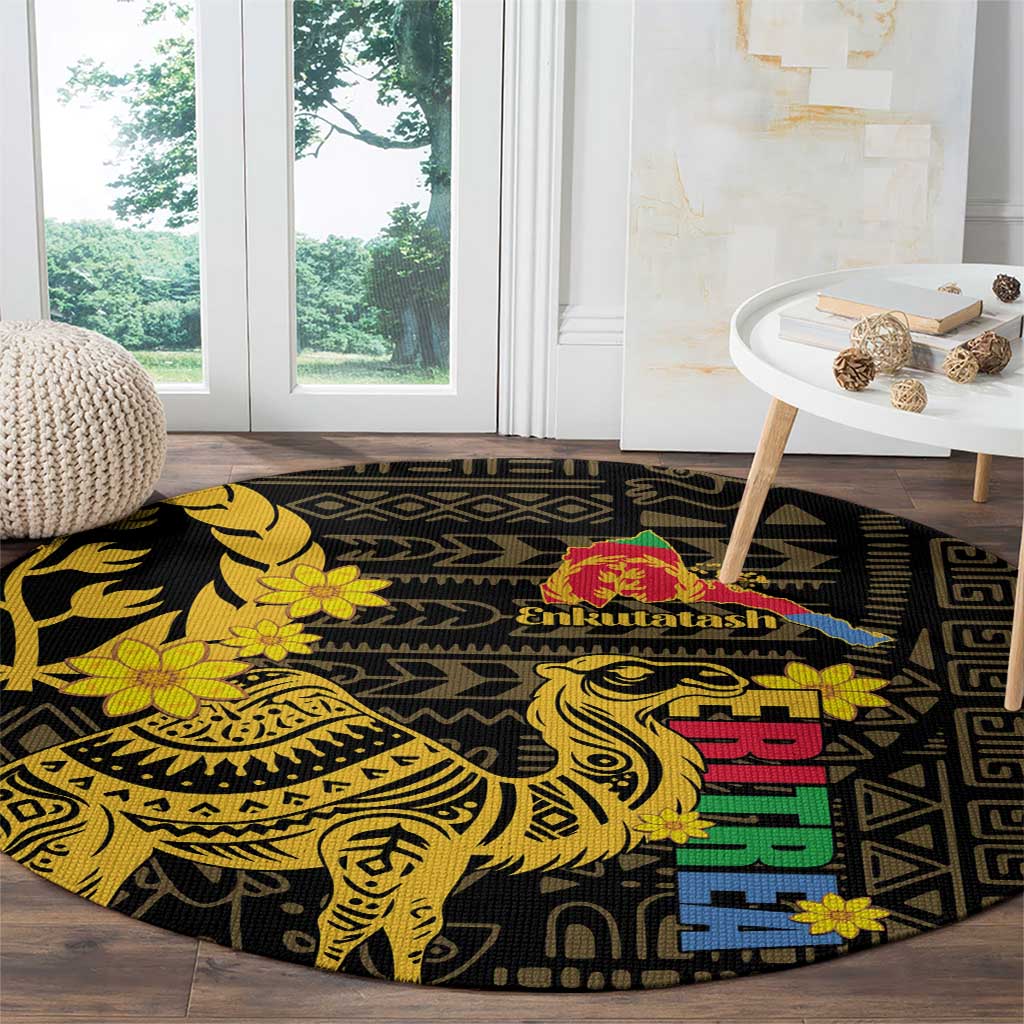 Round black decorative rug with yellow camel figure, floral details, and multicolor pattern blocks
