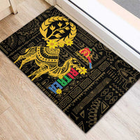 Black rubber doormat with large gold tree wreath, camel, and multicolor holiday motif