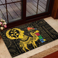 Black rubber doormat with gold camel and floral Eritrean-style pattern, red accents