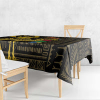Black and gold geometric patterned tablecloth draped over a dining bench